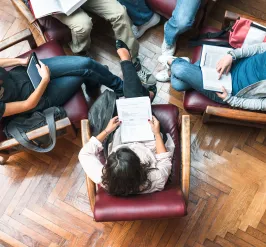 Group of people in a circle of chairs